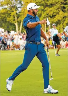  ?? THE ASSOCIATED PRESS ?? Dustin Johnson reacts after making a putt on the 18th green to force a playoff against Jordan Spieth during the final round of The Northern Trust on Sunday in Old Westbury, N.Y.