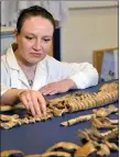  ??  ?? „ Dr Anwen Caffell of Durham University with some of the bones.