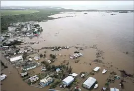  ?? Alejandro Granadillo Associated Press ?? FLOODED HOMES in Salinas, Puerto Rico. Authoritie­s reported two deaths from the hurricane — one in Puerto Rico and one in the Dominican Republic.