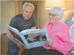  ?? ?? Ruth Tesmond, an independen­t living resident of Smith Village in Chicago’s Beverly neighborho­od, visits with her son Don Tesmond, also of Beverly. The two recalled memories in a special book about her husband Don, who passed away at the age of 91 in October 2019.