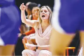  ?? AP FILE PHOTO WADE PAYNE ?? Tennessee women’s basketball coach Kellie Harper said she was proud of her players for not quitting when facing a double-digit deficit late in the first half of Sunday’s eventual 87-69 win against Kentucky in Knoxville.