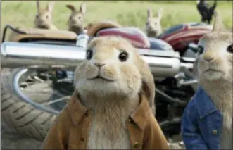  ?? COLUMBIA PICTURES — SONY VIA AP, FILR ?? This filei mage released by Columbia Pictures shows characters Benjamin, voiced by Colin Moody, left, and Peter Rabbit, voiced by James Corden and Cottontail in a scene from “Peter Rabbit.” “