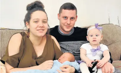  ?? Eddie Garvey ?? ●●Baby Charlie Greenwood with mum Lauren Doherty, dad Zak Greenwood and sister Gracie Greenwood