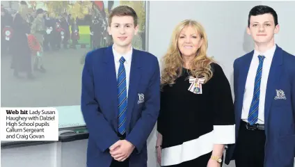  ??  ?? Web hit Lady Susan Haughey with Dalziel High School pupils Callum Sergeant and Craig Govan