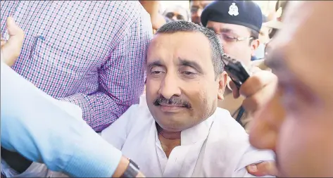  ?? SUBHANKAR CHAKRABORT­Y/HT PHOTO ?? BJP MLA Kuldeep Singh Sengar reacts after being produced at CBI court in Lucknow, in connection with the Unnao rape case.