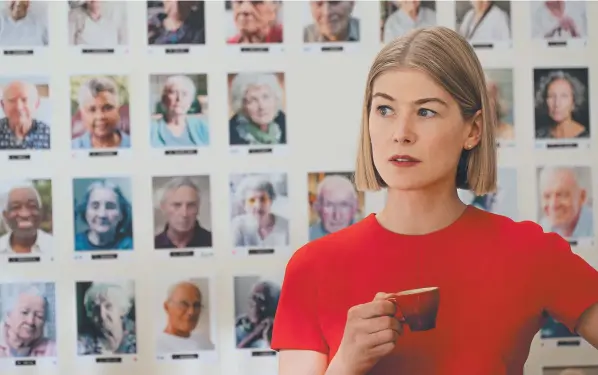  ??  ?? Marla Grayson (Rosamund Pike) with a wall full of elderly people in her ‘care’
