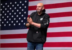  ?? Angela Weiss/AFP via Getty Images ?? Pennsylvan­ia Democratic Senatorial candidate John Fetterman gestures onstage at a watch party during the midterm elections at Stage AE.