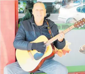  ??  ?? Rex Warbrick has entertaine­d shoppers in Levin now for almost two decades. The photo with guitar was from 2017.