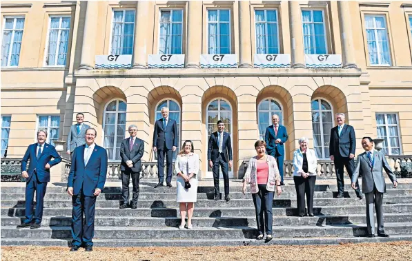  ??  ?? Chancellor Rishi Sunak, centre, hosted finance ministers from the G7 countries and central bank chiefs in London yesterday, where they signed a major deal on tax reform