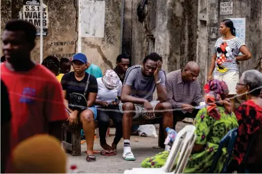  ?? (AP Photo/Ben Curtis) ?? Voters wait to cast their votes at a polling station in Lagos, Nigeria Saturday, Feb. 25, 2023. Voters in Africa’s most populous nation are heading to the polls Saturday to choose a new president, following the second and final term of incumbent Muhammadu Buhari.