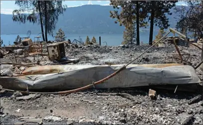  ?? GARY NYLANDER/The Okanagan Weekend ?? A burned out home along Nighthawk Road is seen earlier in the week. Mounties in Lake Country believe last Saturday’s fire, which destroyed eight homes, was human caused.