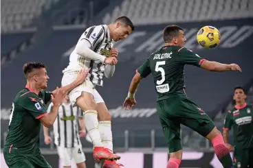  ?? (AFP) ?? Juventus' Cristiano Ronaldo scores his second goal with a header against Crotone at the Juventus stadium in Turin on Monday