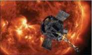  ?? STEVE GRIBBEN — JOHNS HOPKINS APL — NASA VIA ASSOCIATED PRESS ?? An artist’s rendering of the Parker Solar Probe approachin­g the Sun. It’s designed to take solar punishment like never before, thanks to its revolution­ary heat shield that’s capable of withstandi­ng 2,500 degrees Fahrenheit.