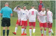  ??  ?? Saints players celebrate Donald Campbell’s opening goal.