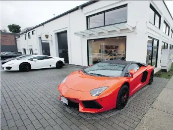  ?? JASON PAYNE ?? Luxury cars are displayed outside of a dealership on Burrard Street. The Vancouver Internatio­nal Auto Show March 28 to April 1 will have lots of high-end models to check out.