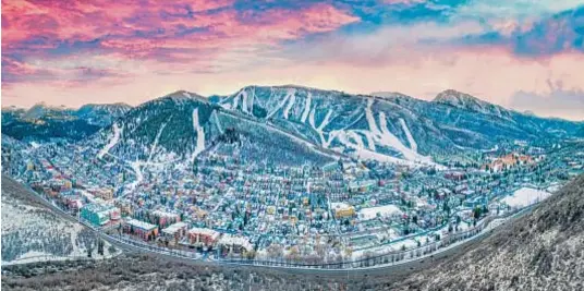  ?? Photo by Kevin Ruck / Adobe Stock ?? Charming ski country towns offer great snow and luxury experience­s.