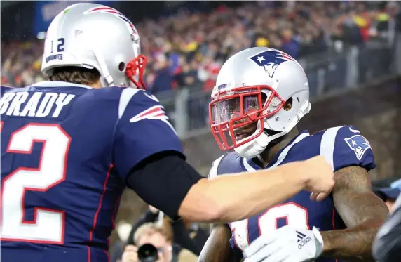  ?? NANCY LANE / BOSTON HERALD ?? WELL-RECEIVED: Josh Gordon and Tom Brady celebrate a touchdown pass during the Patriots’ victory Sunday against the Vikings at Gillette Stadium.