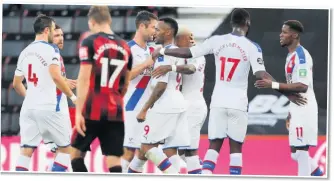  ??  ?? JOY AND DESPAIR Palace celebrate Ayew’s strike as Eddie Howe (left) lambasts