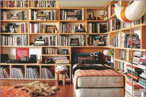  ?? Photos courtesy of Shade Degges ?? Above: a reading nook in the Los Angeles home of Roman Alonso is layered and colorful, with a daybed, records, pottery and books. Nina Freudenber­ger's book "Bibliostyl­e: How We Live at Home with Books" showcases bookshelve­s from around the world; below: The Berlin apartment of Emmanuel de Bayser showcases his collection of midcentury-modern design and eclectic books. Titles, organized loosely by subject, are displayed with small vases and ceramics.