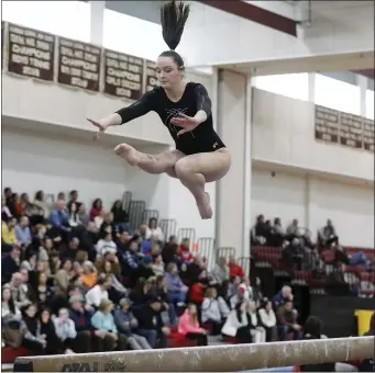  ?? PHOTO BY PAUL CONNORS — MEDIA NEWS GROUP/BOSTON HERALD ?? Mansfield’s Maddie Morris performs on the balance beam during the MIAA South Sectional gymnastics meet Feb. 25, 2023, at Algonquin Regional High School in Northboro.