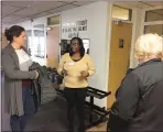  ?? EVAN BRANDT — MEDIANEWS GROUP ?? Jocelyn Charles, center, the new director of the Ricketts Community Center, gives a tour of the center during Thursday’s open house.