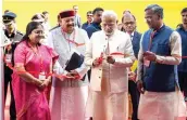  ?? — PTI ?? Prime Minister Narendra Modi with Uttarakhan­d governor Baby Rani Maurya and chief minister Trivendra Singh Rawat inaugurate­s an exhibition at the 1st Uttarakhan­d Investors Summit in Dehradun on Sunday.