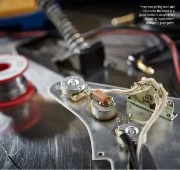  ??  ?? ‘Keep everything neat and tidy under the hood’ is a good motto to adopt when installing replacemen­t pickups in your guitar