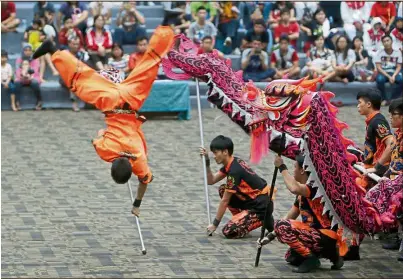  ??  ?? Fierce performanc­e: Chinese performers during the Dragon and Lion Dance World Competitio­n, as part of TAFISA World Sport event in Jakarta, Indonesia. The event is held to celebrate world cultures and traditiona­l sports. — EPA