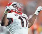  ?? CHRIS CARLSON/AP ?? Georgia linebacker Nakobe Dean, drafted by the Eagles, celebrates after sacking Clemson quarterbac­k D.J. Uiagalelei on Sept. 4.