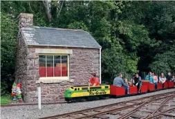  ?? ?? The Bimpson Rio Grande petrol locomotive passes the old weighbridg­e hut on return to the 7¼in gauge terminus at Dockside, located behind the narrow gauge Weighside station.