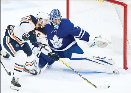  ??  ?? Toronto Maple Leafs goaltender Frederik Andersen (31) makes a save against Edmonton Oilers center Connor McDavid (97) during the first period of an NHL hockey game on Jan 20, in Toronto. (AP)