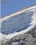  ?? LUCA BRUNO/AP ?? A rescue helicopter hovers over the Punta Rocca glacier near Canazei, in the Italian Alps, Monday.