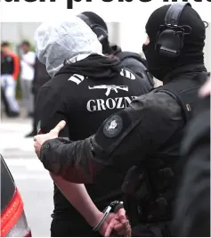  ??  ?? French policemen arrest a man in Strasbourg, suspected to be related to Azimov. — AFP photo