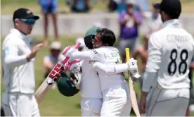  ?? Photograph: Michael Bradley/AFP/Getty Images ?? Mominul Haque and Mushfiqur Rahim celebrate after securing an eight-wicket win at Mount Maunganui.