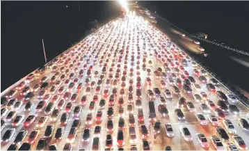 ??  ?? Vehicles are seen jammed on a express way near a toll station, at the end of the Mid-Autumn Festival holiday, in Zhengzhou, Henan province, China. China’s economy is expected to grow 6.3 per cent in 2019, the ADB said, slower than its 6.4 per cent forecast in July and weaker than its 6.6 per cent growth estimate for 2018, which was unchanged from its previous projection. — Reuters photo