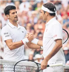  ?? AFP ?? Novak Djokovic, left, shakes hands with Roger Federer after the Wimbledon final.