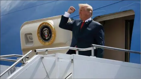  ?? EVAN VUCCI — THE ASSOCIATED PRESS ?? President Donald Trump pumps his fist as he steps off Air Force One after arriving at Ellington Field Joint Reserve Base, in Houston. Trump is right that he has an “absolute” right to pardon, but there is a pretty big loophole in this hypothetic­al: He...