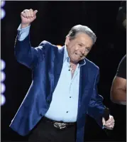  ?? CHRIS PIZZELLO — INVISION/AP ?? Mickey Gilley accepts the triple crown award at ACM Presents Superstar Duets at Globe Life Park in 2015.