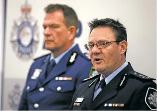  ?? RICK RYCROFT/THE ASSOCIATED PRESS ?? Australian Federal Police Deputy Commission­er Michael Phelan, right, and New South Wales state Police Deputy Commission­er David Hudson discuss details of the charging of two men with terrorism offenses Friday in Sydney. The men, ages 49 and 32, were...