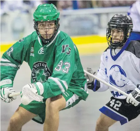  ??  ?? The Shamrocks’ Mack Mitchell, left, pulls away from Langley’s Cole Shafer at The Q Centre on Friday night.