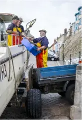  ??  ?? With his crew, eighth-generation fisherman John (opposite) uses techniques honed over 150 years to fish for lobsters, cockles and whelks – as well as the famed Cromer crab