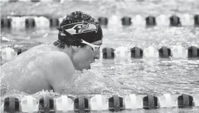  ?? KATHERINE FOMINYKH/CAPITAL GAZETTE ?? Matt Speciale of South River forges ahead in the 200IM during Friday night’s meet. After winning the majority of events, South River swept the boys’ and girls’ meet in the first-ever county-wide meet at the Prince George’s Sports &amp; Learning Complex. For a recap of Friday’s meet, visit capitalgaz­ette.com.