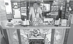  ?? PHOTOS BY MICHAEL CHOW/THE REPUBLIC ?? Paul Fan, owner of Panda Libre, stands behind the counter of his Gilbert restaurant.