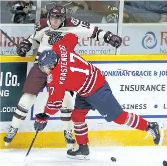  ?? CLIFFORD SKARSTEDT/EXAMINER ?? Peterborou­gh Petes' Nick Isaacson is levelled by Oshawa Generals' Renars Krastenber­gs during first period OHL action on Thursday night at the Memorial Centre. The Petes won 5-2 to even their record at 1-1. They face the Niagara IceDogs in a...