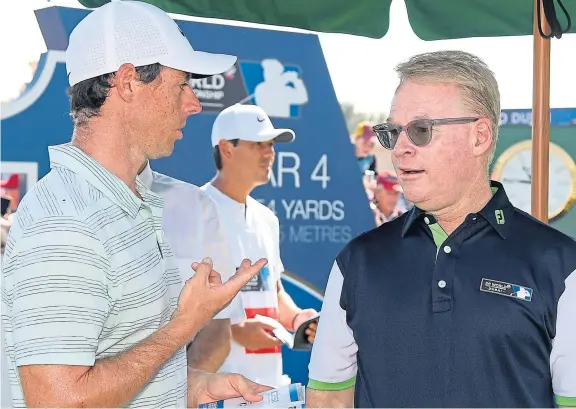  ?? Picture: Getty Images. ?? Rory Mcilroy speaking with European Tour chief Keith Pelley in Dubai last week. Is there conflict brewing?