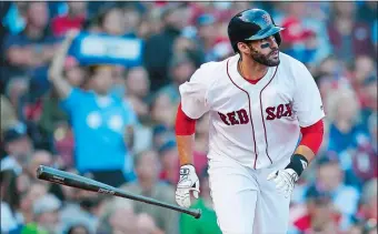  ?? MICHAEL DWYER/AP PHOTO ?? J.D. Martinez of the Boston Red Sox watches his three-run home run during the fourth inning of Sunday’s game against the New York Yankees at Boston. The Red Sox won 10-2.