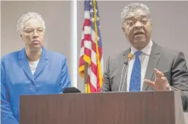  ?? RICH HEIN/SUN-TIMES FILE ?? Cook County Chief Judge Timothy Evans (shown with County Board President Toni Preckwinkl­e last year) had filed suit to avoid layoffs in his office.