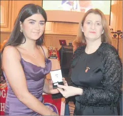  ?? ?? Caoilainn Ryan, from Newtownsha­ndrum (left), a granddaugh­ter of Joe and Ann Thornton, Ballybeg, Mitchelsto­wn, pictured receiving her U16 A All-Ireland winners camogie medal (2023) from Camogie president, Hilda Breslin, at the recent awards ceremony in Rochestown Park Hotel, Cork.