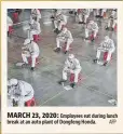  ?? AFP ?? MARCH 23, 2020: Employees eat during lunch break at an auto plant of Dongfeng Honda.
