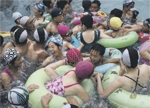  ?? PICTURE: AFP ?? Swimmers gather in a wave pool at a water park in a leisure complex in North Korean capital Pyongyang as the US announced travel restrictio­ns